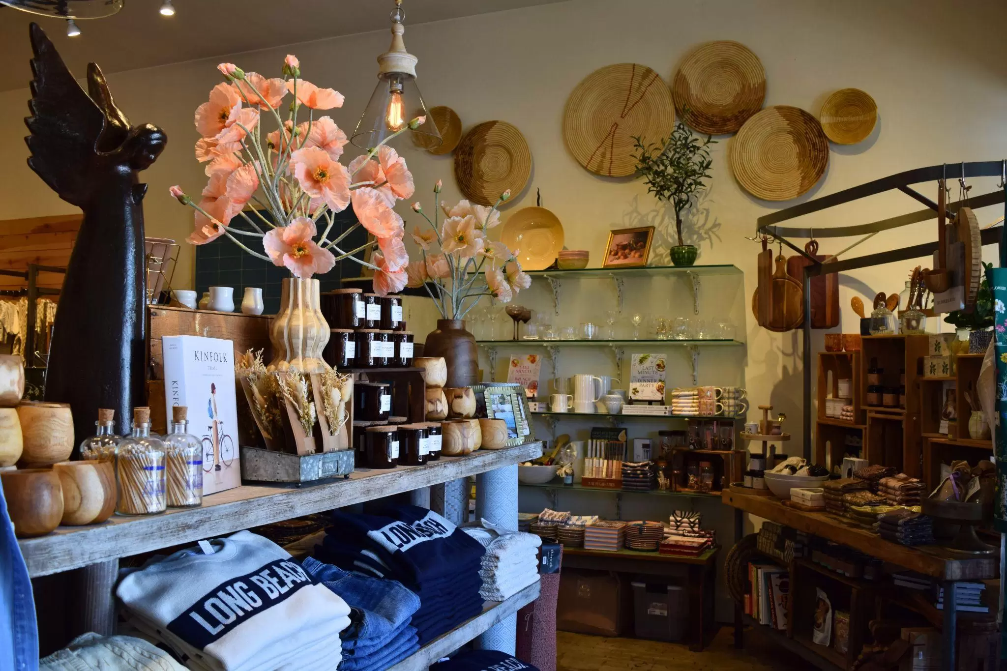 Blue Windows boutique entry with Long Beach merchandise and artisan goods