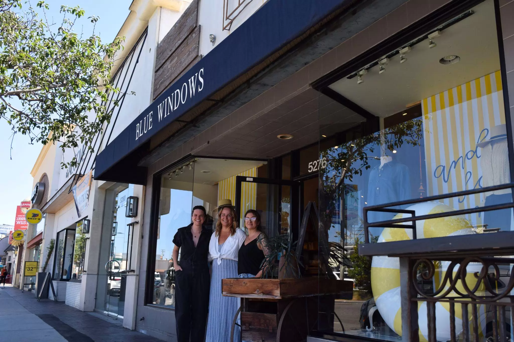 Mariah Russell, Heather Duncan and Megan Bigos in front of Blue Windows on 2nd Street